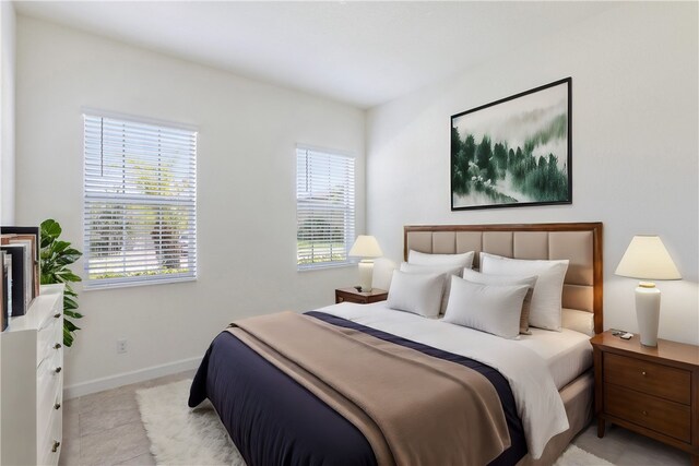 tiled bedroom with multiple windows