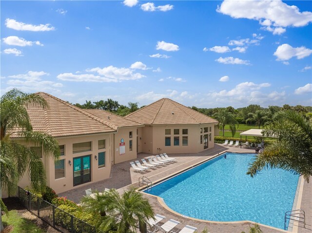 view of swimming pool featuring a patio area