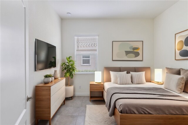 bedroom featuring light tile patterned floors