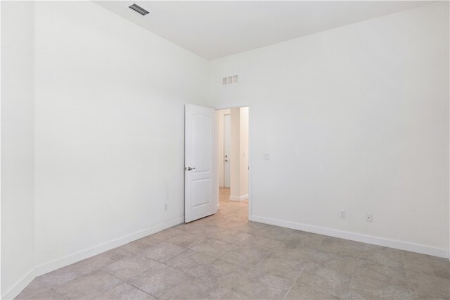 unfurnished room with light tile patterned floors