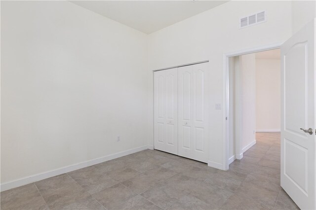 unfurnished bedroom with a closet