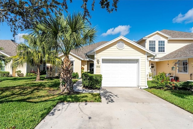 view of front of property featuring a garage and a front yard