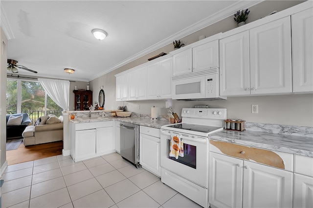 kitchen featuring light tile patterned floors, ceiling fan, crown molding, white cabinetry, and white appliances