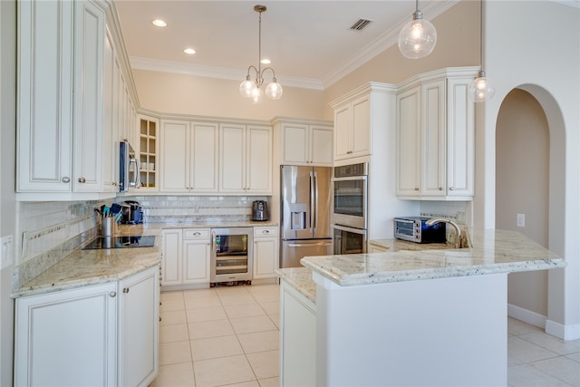 kitchen with kitchen peninsula, pendant lighting, appliances with stainless steel finishes, white cabinetry, and wine cooler