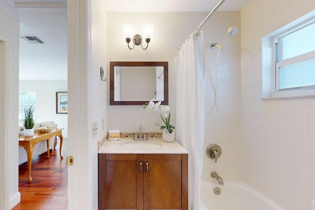 bathroom featuring shower / tub combo, vanity, and hardwood / wood-style flooring