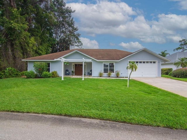 single story home featuring a front yard, concrete driveway, and an attached garage