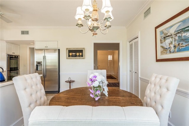 1250 W Southwinds Blvd Unit 310, Vero Beach, FL 32963 - dining area with a chandelier, ornamental molding, and a ceiling fan
