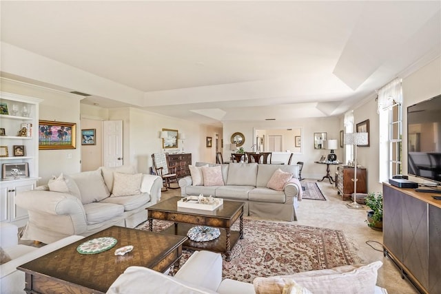 1250 W Southwinds Blvd Unit 310, Vero Beach, FL 32963 - living area featuring a tray ceiling