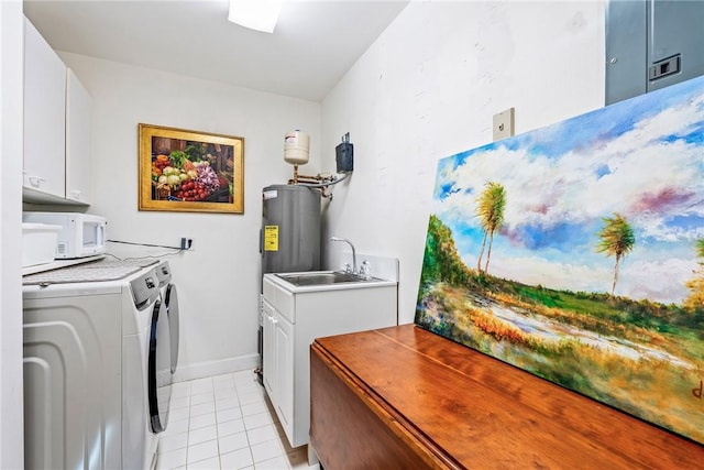 1250 W Southwinds Blvd Unit 310, Vero Beach, FL 32963 - laundry room with separate washer and dryer, water heater, light tile patterned floors, and cabinet space