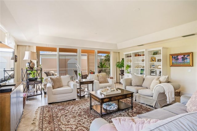 1250 W Southwinds Blvd Unit 310, Vero Beach, FL 32963 - living area featuring plenty of natural light and a tray ceiling