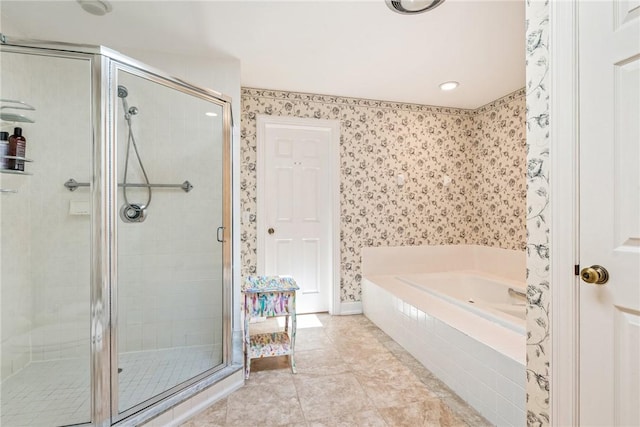 1250 W Southwinds Blvd Unit 310, Vero Beach, FL 32963 - bathroom with wallpapered walls, a shower stall, a bath, recessed lighting, and tile patterned flooring