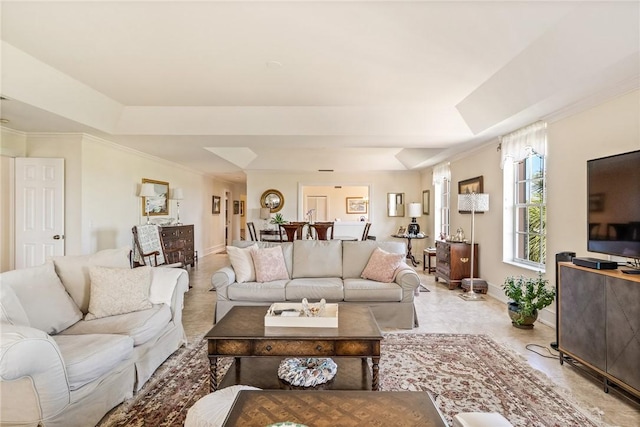 1250 W Southwinds Blvd Unit 310, Vero Beach, FL 32963 - living area featuring a raised ceiling and baseboards