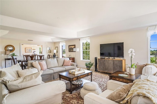 1250 W Southwinds Blvd Unit 310, Vero Beach, FL 32963 - living room with healthy amount of natural light and a raised ceiling