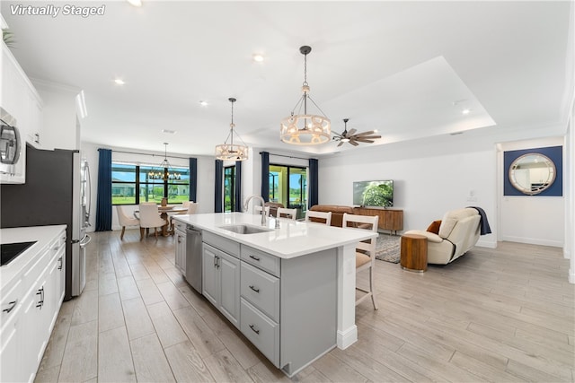 6354 Arcadia Sq, Vero Beach, FL 32966 - kitchen with a chandelier, a sink, stainless steel appliances, open floor plan, and a center island with sink