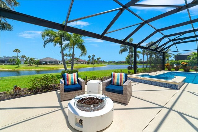 6354 Arcadia Sq, Vero Beach, FL 32966 - view of patio with an outdoor fire pit, a water view, glass enclosure, and a pool with connected hot tub