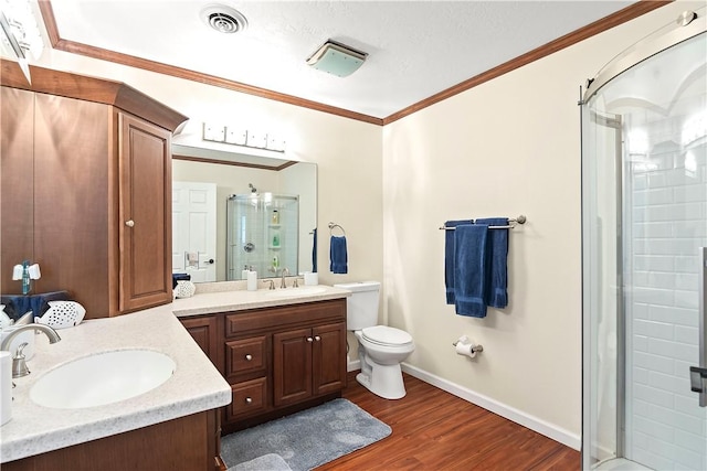 955 28th Ave, Vero Beach, FL 32960 - full bath featuring a stall shower, vanity, wood finished floors, toilet, and baseboards