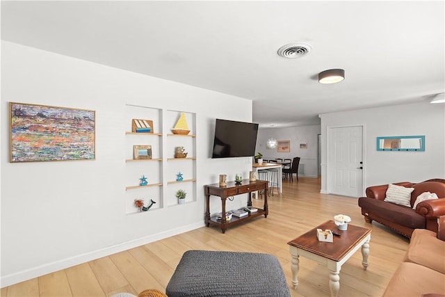 955 28th Ave, Vero Beach, FL 32960 - living room with light wood-style floors and baseboards