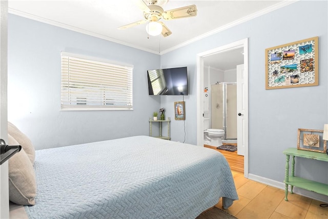 955 28th Ave, Vero Beach, FL 32960 - bedroom featuring wood finished floors, crown molding, baseboards, ensuite bathroom, and ceiling fan