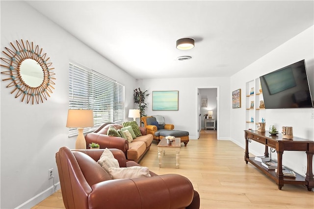 955 28th Ave, Vero Beach, FL 32960 - living room with baseboards and light wood-style flooring
