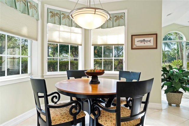 1080 Carolina Cir SW, Vero Beach, FL 32962 - dining room featuring light tile patterned flooring and lofted ceiling
