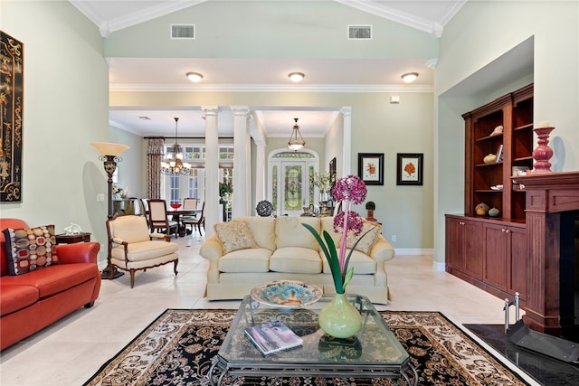 tiled living room with ornamental molding, lofted ceiling, ornate columns, and an inviting chandelier