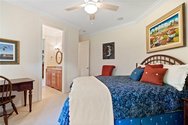 carpeted bedroom with ornamental molding, sink, ceiling fan, and ensuite bath