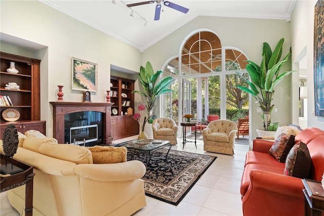 tiled living room featuring ceiling fan, high vaulted ceiling, and ornamental molding