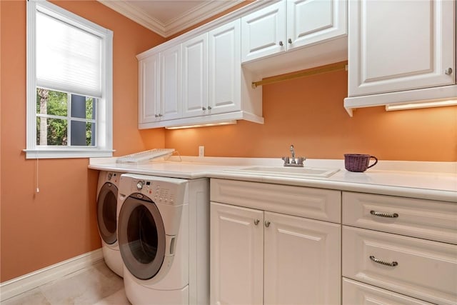 1080 Carolina Cir SW, Vero Beach, FL 32962 - laundry room with independent washer and dryer, cabinet space, and crown molding