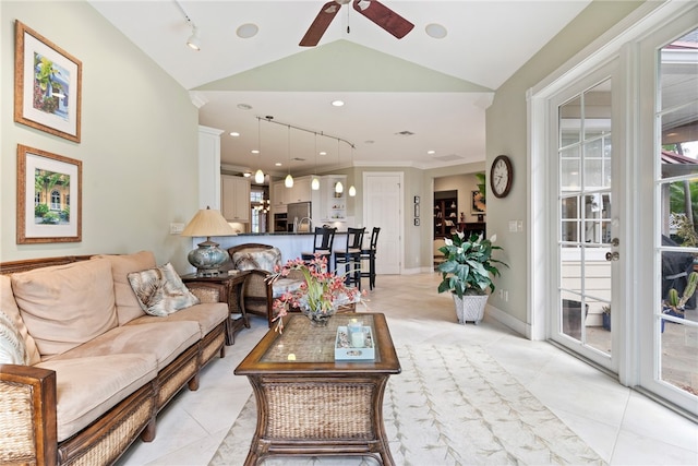 living room featuring ornamental molding, ceiling fan, vaulted ceiling, and light tile patterned flooring