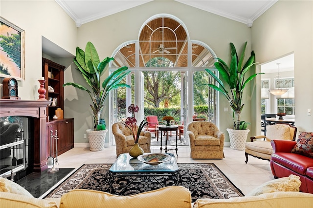 interior space featuring lofted ceiling, a high end fireplace, ornamental molding, and plenty of natural light