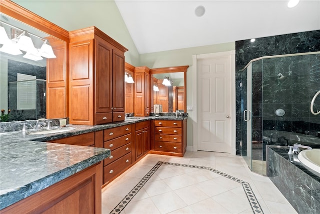 bathroom featuring vanity, lofted ceiling, tile patterned flooring, and separate shower and tub