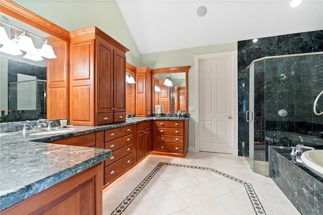 1080 Carolina Cir SW, Vero Beach, FL 32962 - full bath with a bath, vanity, lofted ceiling, a stall shower, and tile patterned floors