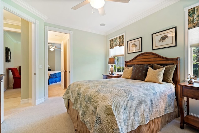 carpeted bedroom with ceiling fan and crown molding