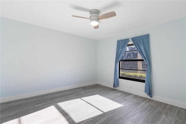 12 Plantation Dr Unit 104, Vero Beach, FL 32966 - spare room featuring wood finished floors, baseboards, and a ceiling fan