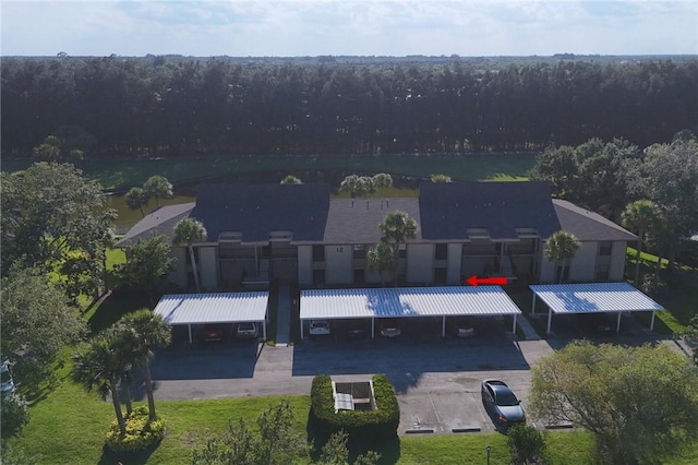 12 Plantation Dr Unit 104, Vero Beach, FL 32966 - view from above of property with a forest