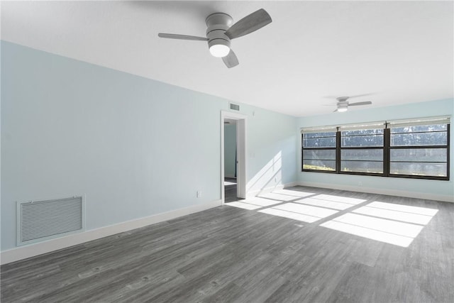 12 Plantation Dr Unit 104, Vero Beach, FL 32966 - spare room featuring ceiling fan, wood finished floors, and baseboards