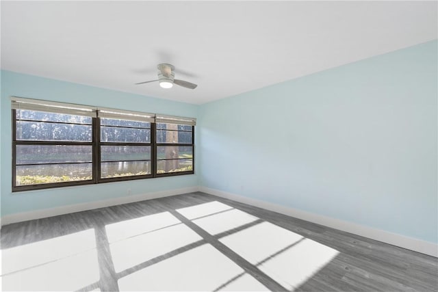 12 Plantation Dr Unit 104, Vero Beach, FL 32966 - spare room with wood finished floors, a ceiling fan, and baseboards