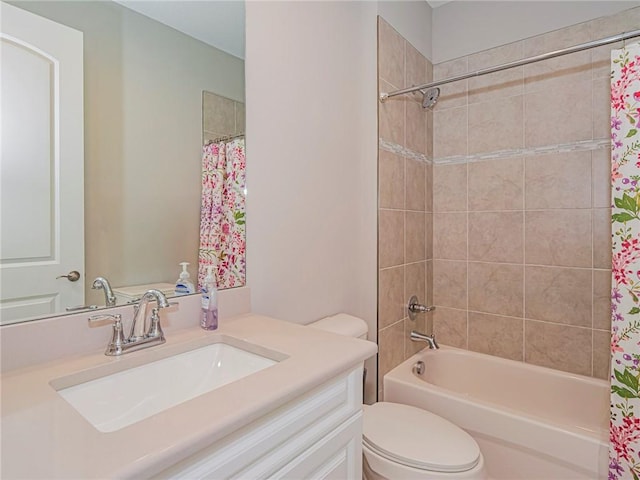 full bathroom featuring vanity, shower / bath combination with curtain, and toilet