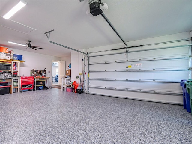 garage featuring ceiling fan and a garage door opener