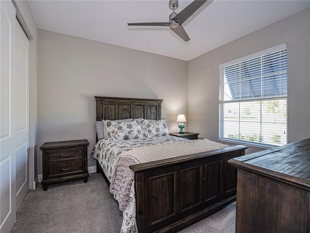 bedroom with light colored carpet, a closet, and ceiling fan