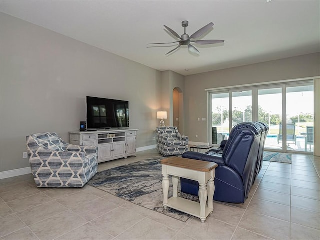 tiled living room featuring ceiling fan