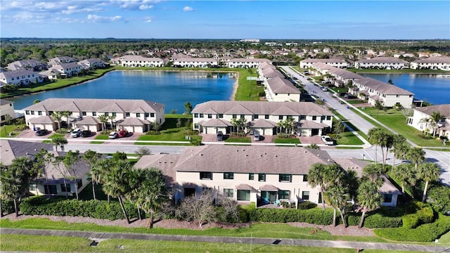 bird's eye view with a residential view and a water view