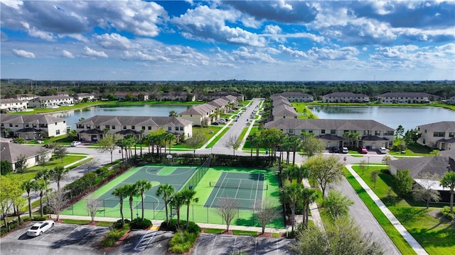 aerial view with a water view and a residential view