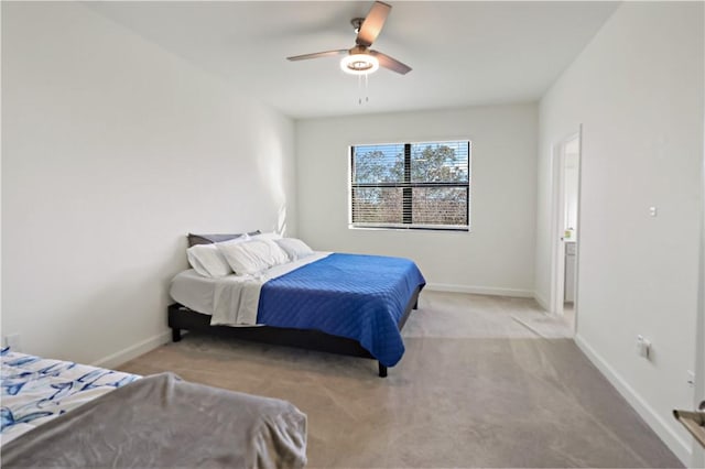 carpeted bedroom featuring a ceiling fan and baseboards