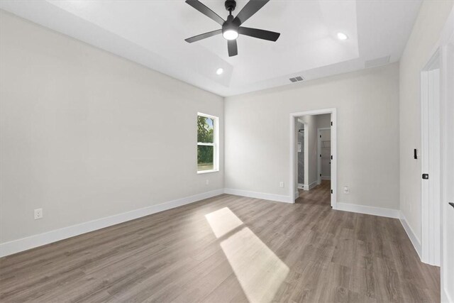 unfurnished room featuring hardwood / wood-style flooring