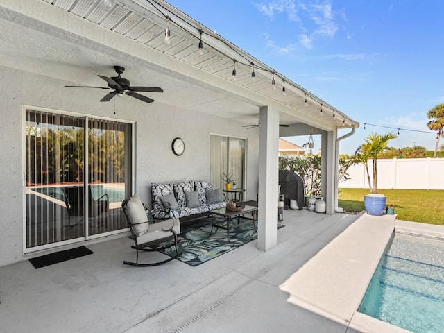 view of patio / terrace featuring fence, a fenced in pool, area for grilling, ceiling fan, and an outdoor hangout area