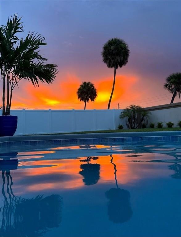 view of pool featuring fence