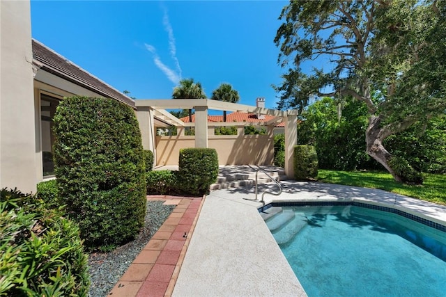 view of swimming pool featuring a patio, a swimming pool, and a pergola