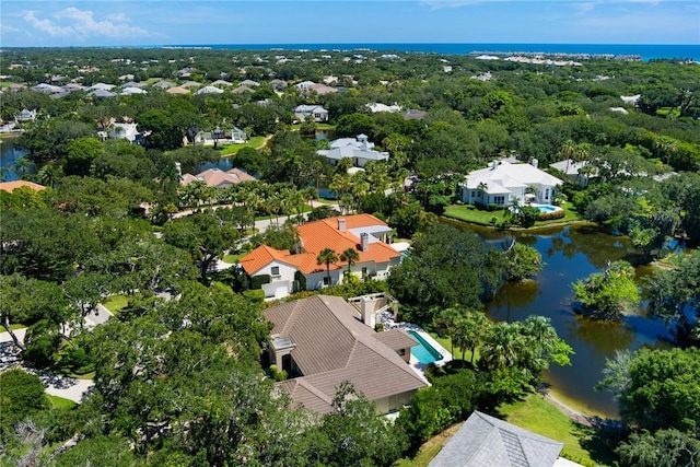 birds eye view of property with a residential view and a water view