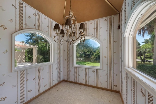 interior space featuring a chandelier and light floors